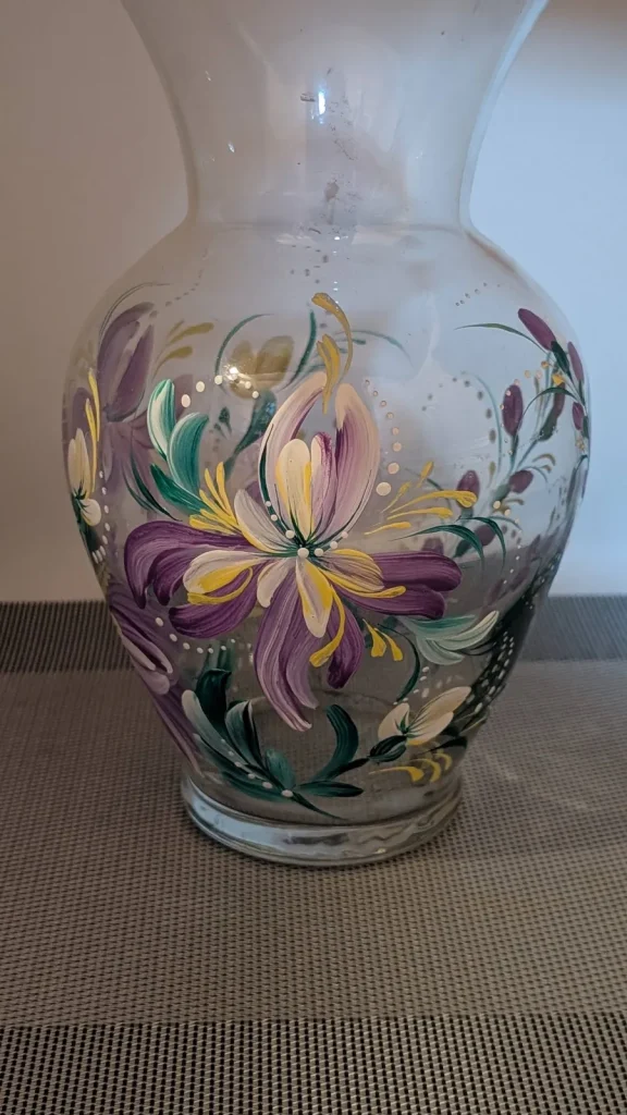 Glass vase with purple and yellow florals