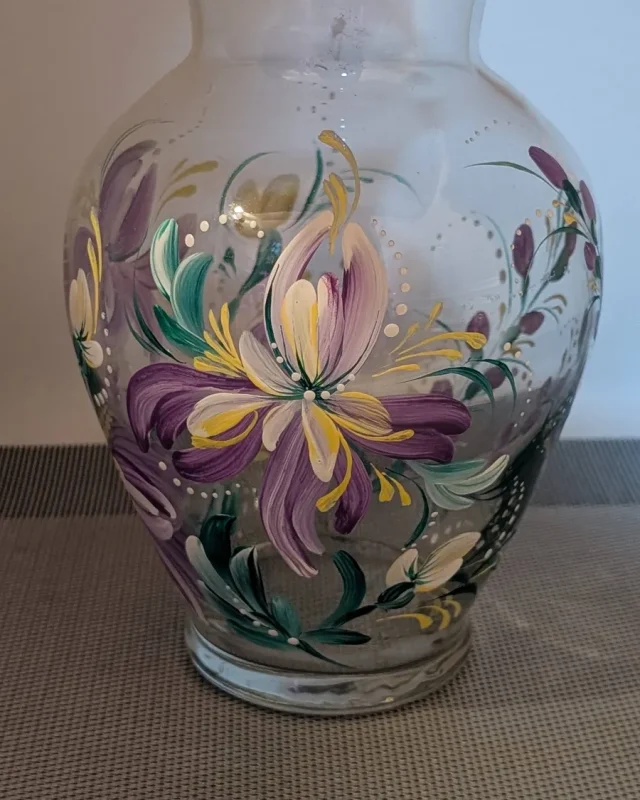 Glass vase with purple and yellow florals