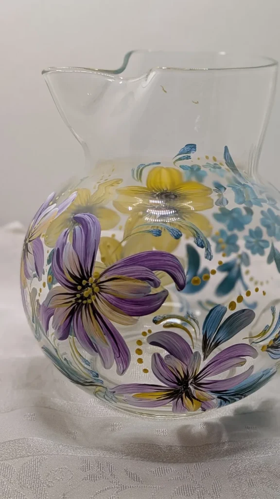 Glass pitcher with purple and yellow mixed florals