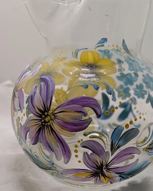 Glass pitcher with purple and yellow mixed florals